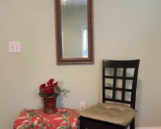 Guest room setting, chair plus mirror plus custom curtain panel with monkey/palm motif.