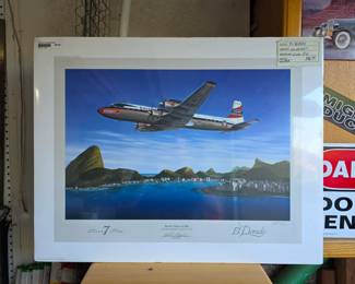 "Seven Seas to Rio," by artist Mike Machat, depicting a Douglas DC-7C airliner