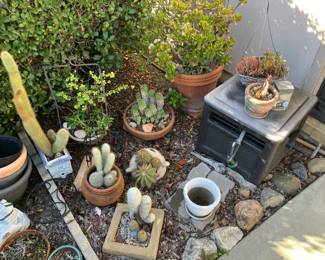 Garden items including a hose container