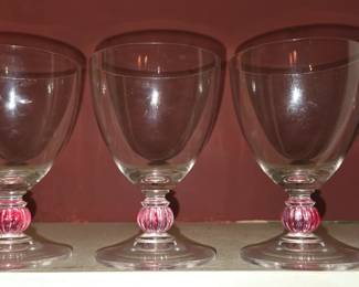 Clear glass goblets with a pink ball stem base. MCM