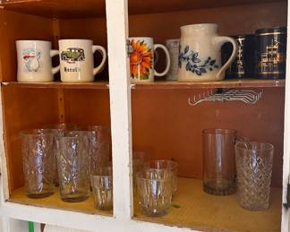 Assorted coffee cups and drinking glasses