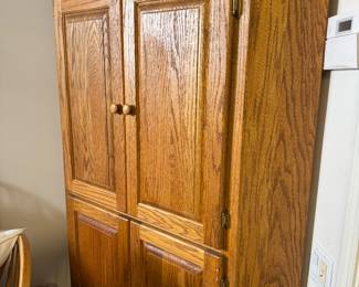 $220 - Corner oak cabinet 