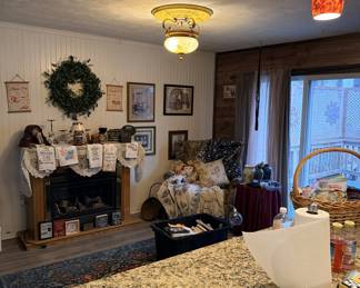 Fireplace, wall decor, various decorative items, chair.