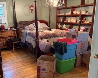 King bed, china, end table, chairs, decor.