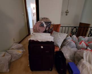 Three piece — two with four wheels each — luggage set, chair, throw pillows, clothing, bedding, curtains are all in great condition.