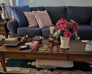 Two matching end tables and coffee table are vintage and are in excellent condition. Both the sofa and matching loveseat are in like new condition.