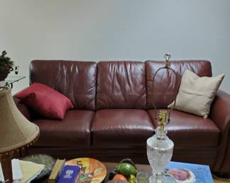 Leather sofa and matching recliner are in excellent condition. Many books, decorative pillows, pictures, and other items are also available and in great condition.