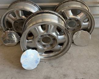 Group of three GMC alloy wheels with center caps