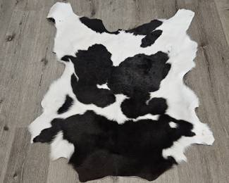 Genuine Black & White Cow Skin Rug is 36in x 44in