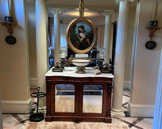 Victorian marble top console “petticoat table,” Louis Phillipe porcelain bowl in gilt bronze mount, pair of metal and brass table lamps, artwork, pair of Chelsea House porcelain obelisks, sconces,  iron umbrella stand, rug
