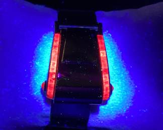 14K BUCKLE BANGLE WITH OVER 3 CTW OF RUBIES 42.2G THIS DESIGNER BUCKLE BANGLE FEATURES 26, 12PT PRINCESS CUT RUBIES AND 2, 15PT CABOCHON RUBIES, ONE ON EACH SIDE. THIS PIECE IS GUARANTEED TO TURN HEADS AT EVERY OCCASION. CARAT WEIGHTS ARE APPROPRIATE.