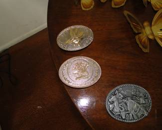 Belt buckles. We have a very nice collection of some very nice belt buckles