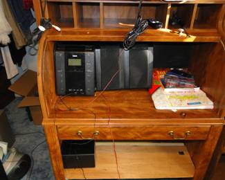 Electronics and a rolltop desk