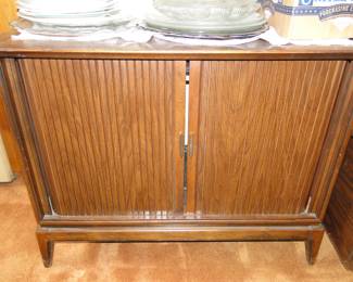 Cabinet with rolling doors