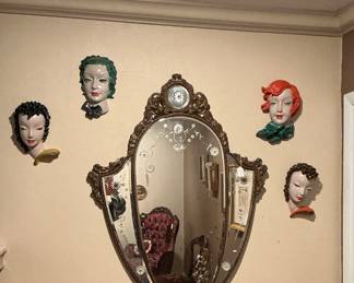 Gorgeous old mirror,  and 4 Antique Art Deco pottery masks.