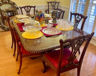 Well kept formal dining set with 8 chairs and red satin cushions