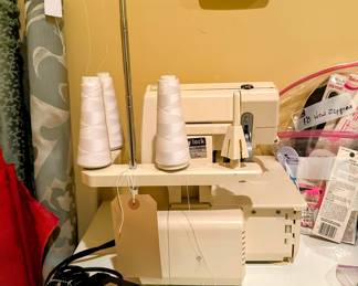 Baby Lock Sewing Machine with lots of thread spools. 