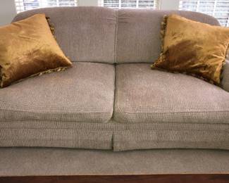 Down filled sofa with feathers escaping