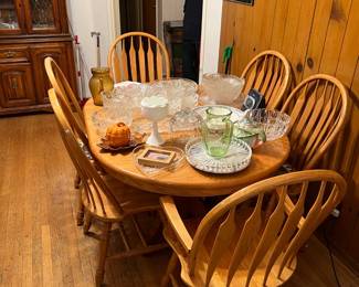 This is the first of two views of this dining table and six matching chairs.  Don't forget to look at the crystal and glass serving pieces on the table.