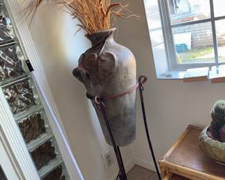 Tall clay pot, dried wheat with metal base