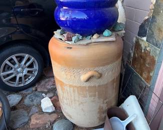 Large, I mean large pots, waist high, pots on top of pots, lost of rocks of all sizes. Did I say lots, yet lots.