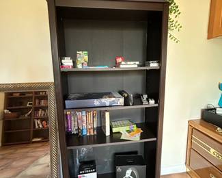 Dark Wood Bookshelf with Assorted Items