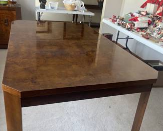 5.5’ with no leafs. Has 2 additional leafs each 1’.  Table Pad included. 40” W