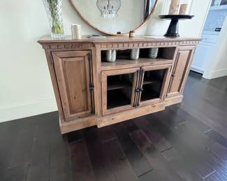 Wood entertainment cabinet used as sideboard in dining.  $300