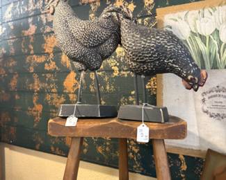 rustic wood stool and speckled chicken figurines, brass tray
