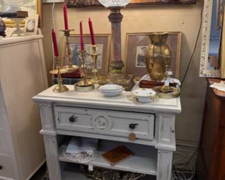 large bedside table, candlesticks, brass vase, lamp