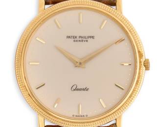 Patek Philippe Calatrava 18K yellow gold quartz watch, with a cream dial and Kreisler brown crocodile leather strap