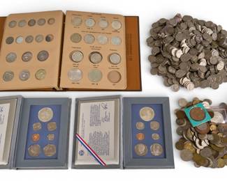 Large coin collection featuring US Mint sets, silver dollars, and a large quantity of loose coins