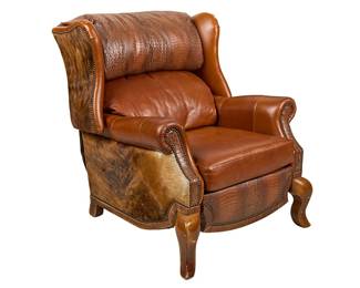 Ranch style armchair with orange leather, crocodile leather, and hair on hide upholstery