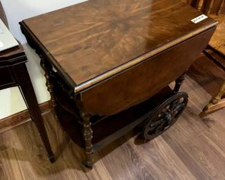 #149	wood tea cart on wheels and flip side  27x17-39x28	 $120.00 
