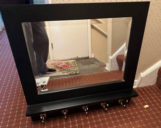 Wall mirror with coat hooks