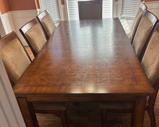 Oxemeny dining room table and 8 chairs
