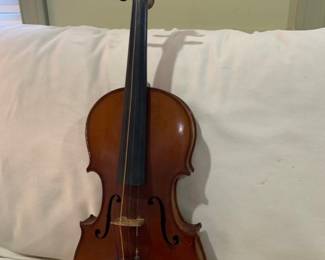 4-string violin that dates to 1917. It comes with the original case, bow and chin guard. With the exception of needing to re-strung the violin is in very good condition.
The label inside the violin reads, "copia di Antonius Stradiuarius and Angela Ferrari.