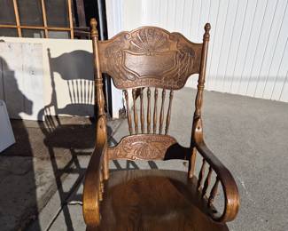 Handcarved tiger oak rocking chair. 