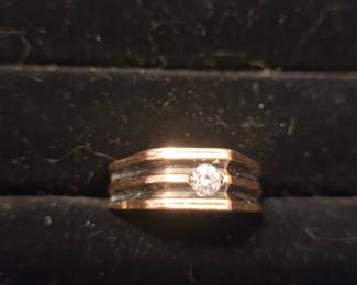 One of several men's Gold and Diamond rings 