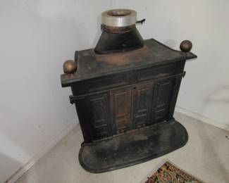 Cast iron corner wood burning fireplace