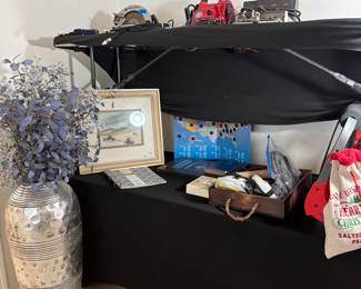 Tools, wires, beautiful silver colored vase with blue flowers, coin holders