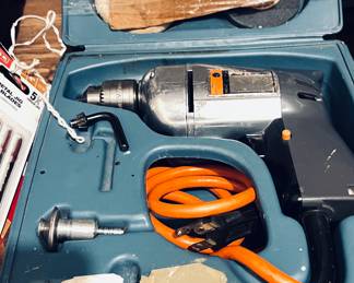 Vintage Black & Decker corded electric drill kit.