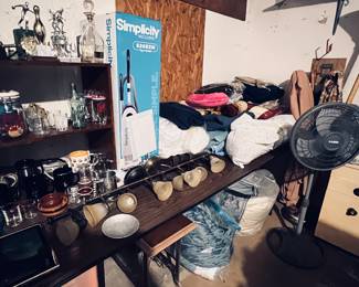 Garage area misc items such as glassware, trophies,blankets,lamps,