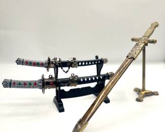 Minature decoartive swords, with a stand 