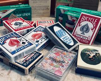 Casino is here in this home, Poker Playing cards, Plastic Chips, and more vintage playing cards included.
