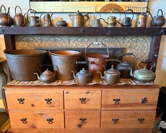 Mixed collection of antique and vintage copper vessels, likely late 19th–early 20th century, with a few later decorative pieces mixed in