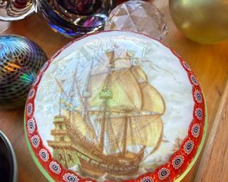 Vintage nautical art glass paperweight featuring a sailing ship, created using a reverse-painted / transfer image under clear glass, with a millefiori-style border