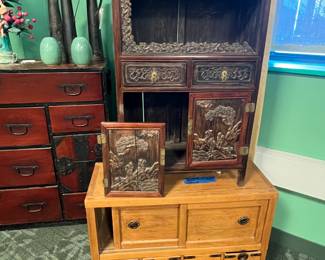 Chinese carved hardwood cabinet with high relief figural landscape, early 20th century, value $1500 OBO;                                                                                             Antique Japanese Tansu Chest Meiji period 19th century, Value $1500 OBO