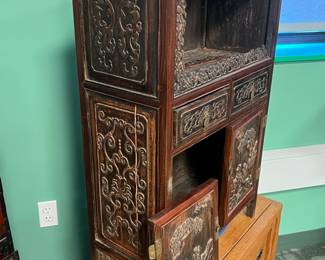 Chinese carved hardwood cabinet with high relief figural landscape, early 20th century, value $1500 OBO; 