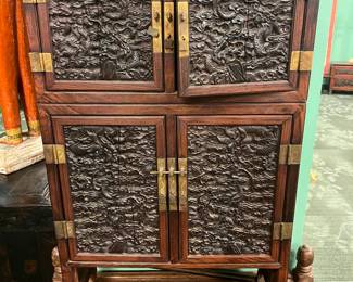 Chinese Carved Hardwood cabinet with Dragon relief panels 20th century, carved dense hardwood possibly Jichimu rosewood . Lower drawer came apart, value $800 OBO